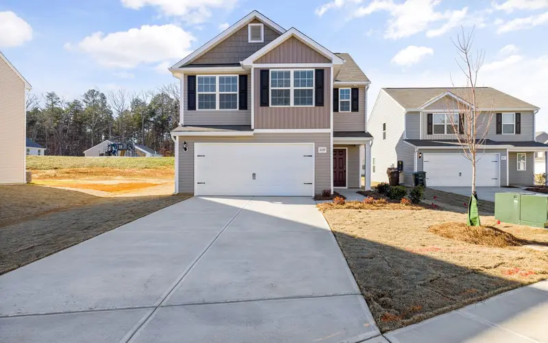 General contractor service area around Hixson, TN: suburban home with concrete driveway